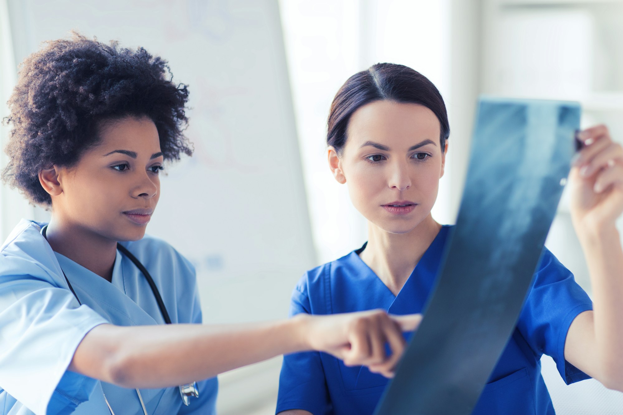 female doctors with x-ray image at hospital